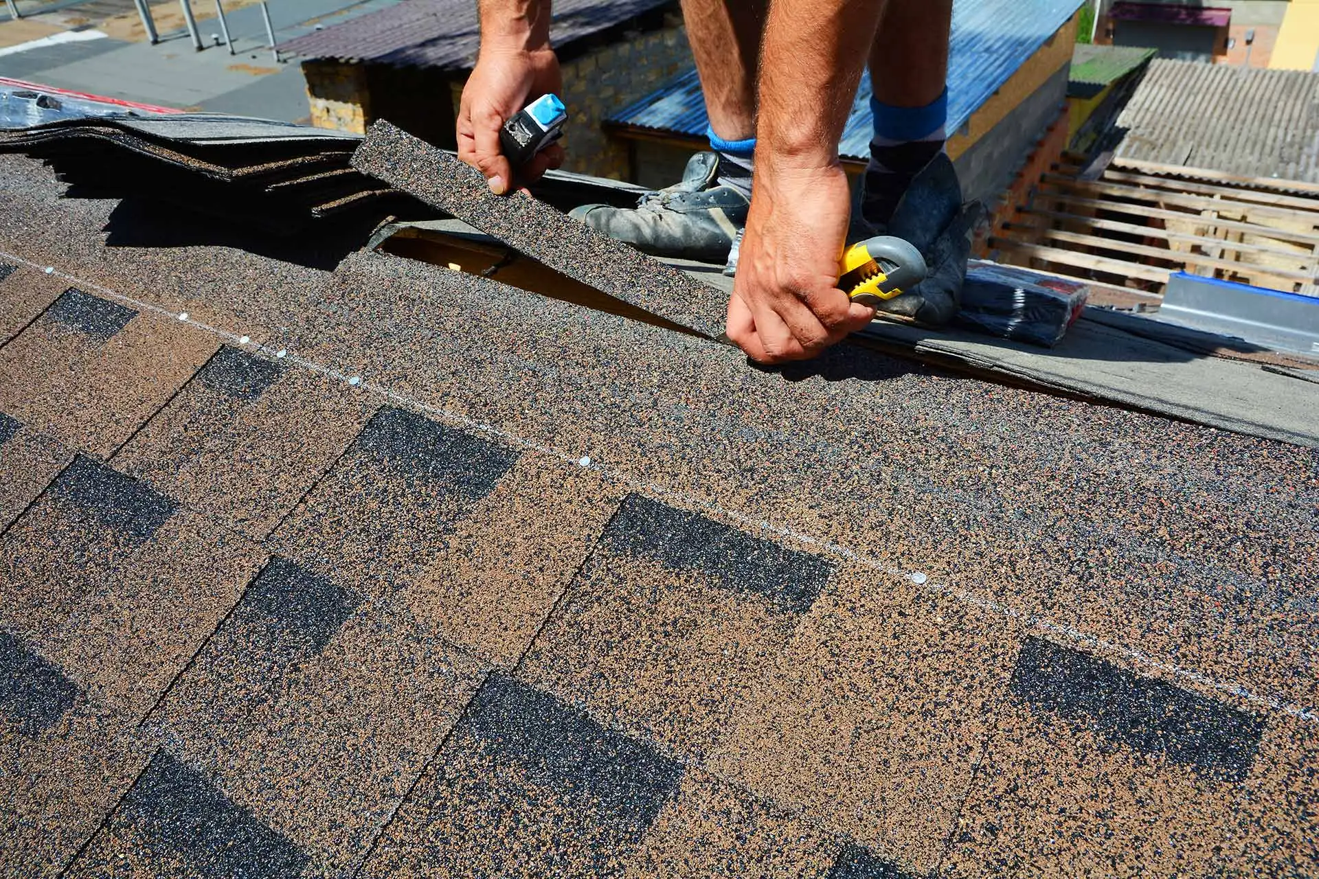 A True Roofers worker repairing shingles on a Wesley Chapel, FL.