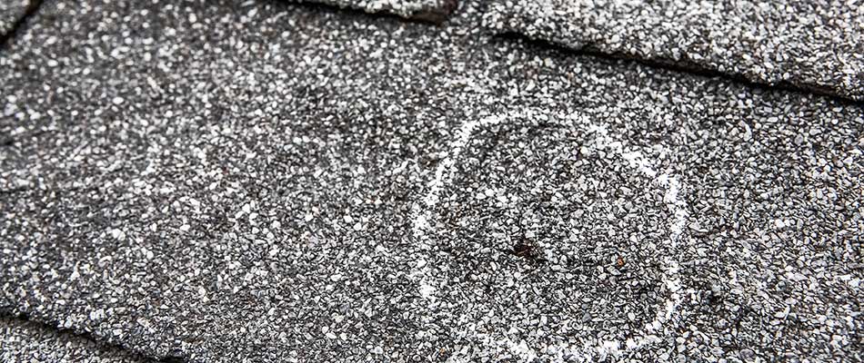 Hail damage marked on a Wesley Chapel, FL home's roof.